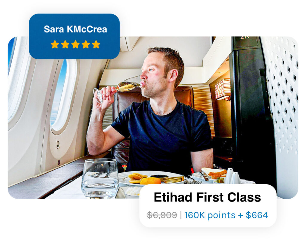 Airline Mile Redemption Course - Nik sitting in an airplane seat drinking Champagne